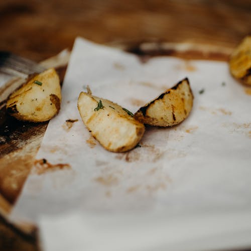 Free Potato Wedges on a Paper Stock Photo