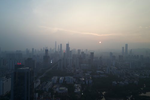 Photo of a Foggy City at Dawn 