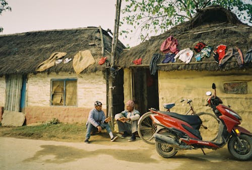 Men Sitting in Front of their Houses