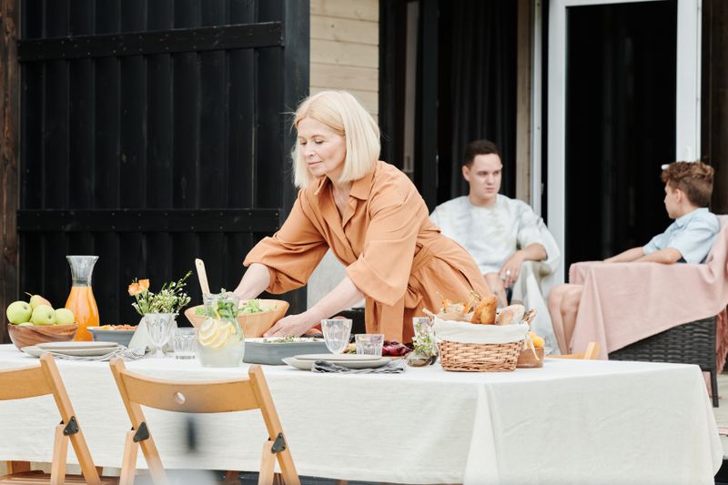 An elegantly set dinner table with linen napkins and candles