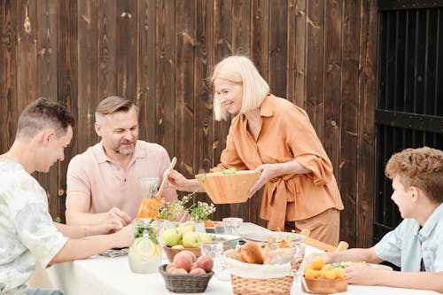 Woman Serving Food for the Family