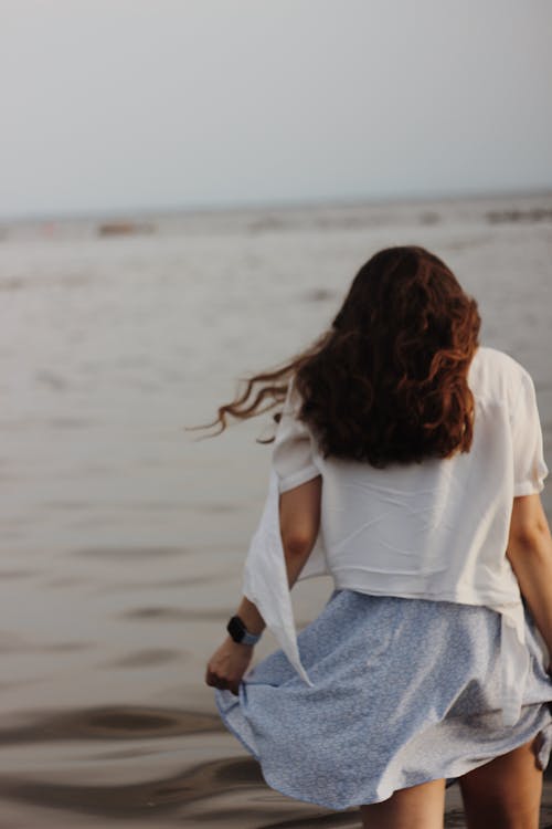 Woman in Red Dress and Dog on Beach · Free Stock Photo