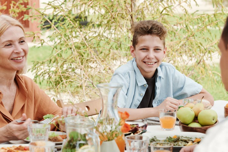 A Happy Family Eating Together 