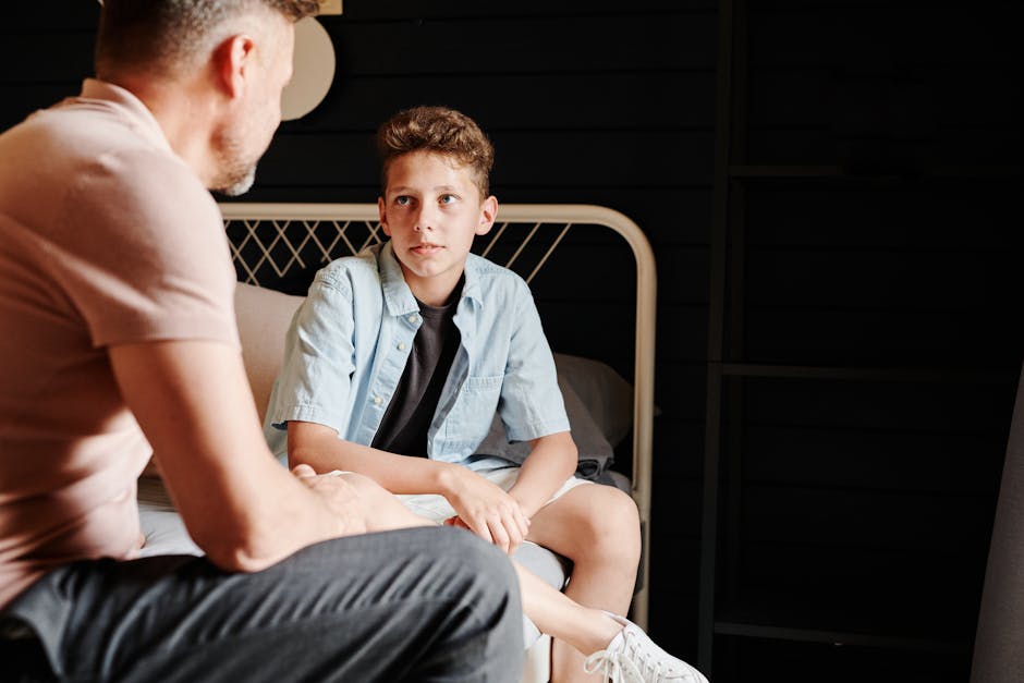 A parent kneeling down to speak with a child at eye level, showing connection and respect - Parenting strategies for discipline A parent kneeling down to speak with a child at eye level, showing connection and respect - Parenting strategies for discipline