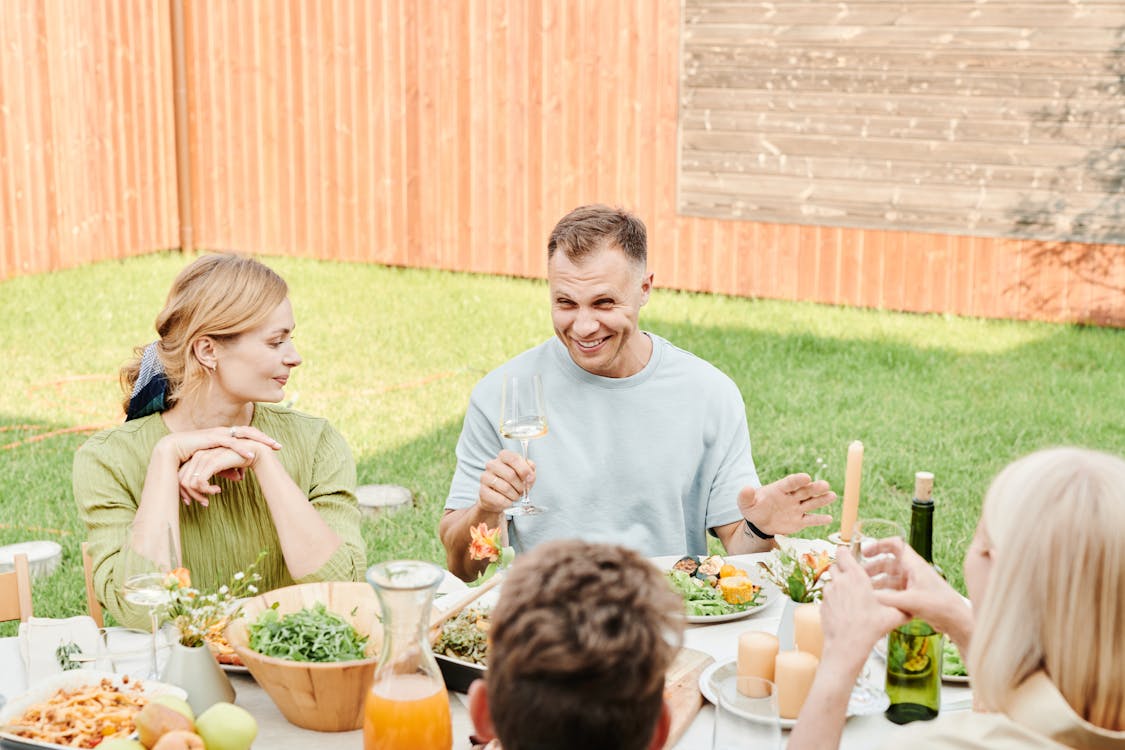 Free A Family Eating at the Backyard  Stock Photo