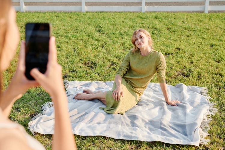 Daughter Taking A Picture Of Her Mom