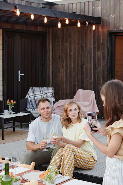 Free Daughter Taking a Picture of Her Parents Stock Photo