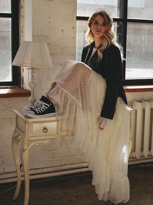 A Woman Wearing a Long Sheer Fabric Skirt