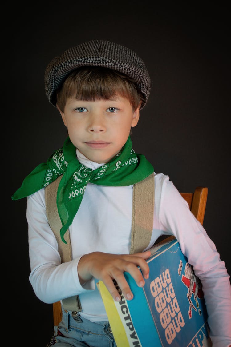 Boy Holding Board Games