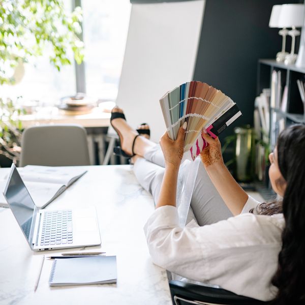 Designer reviewing colour swatches at a desk — photo by Yan Krukau on Pexels