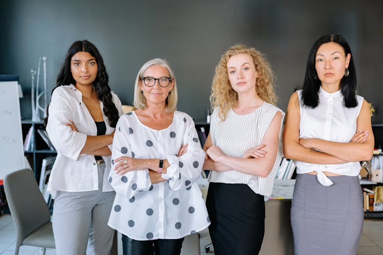 A Businesswomen Standing Together In The Office