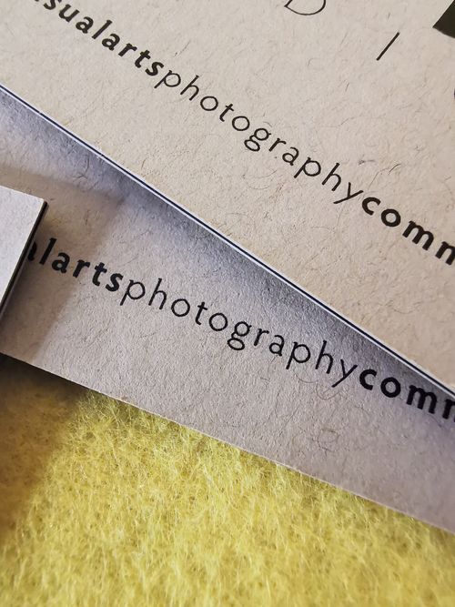 Free Detailed view of paper showcasing visual arts and photography text. Stock Photo
