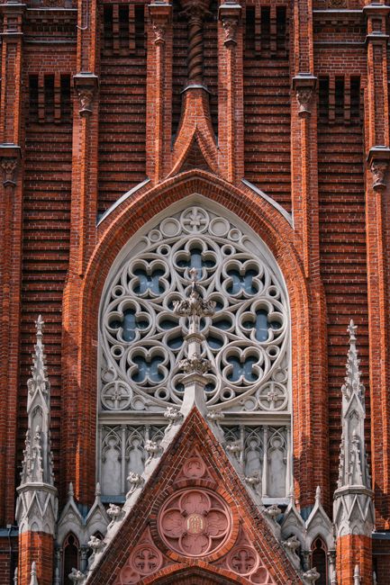 Detailed view of a Neo-Gothic church facade with intricate decorative window in Moscow.