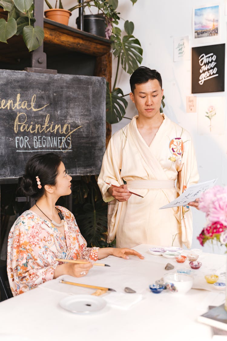 Man And Woman In Kimonos During Painting Course