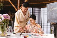 Man and a Woman Drawing Together
