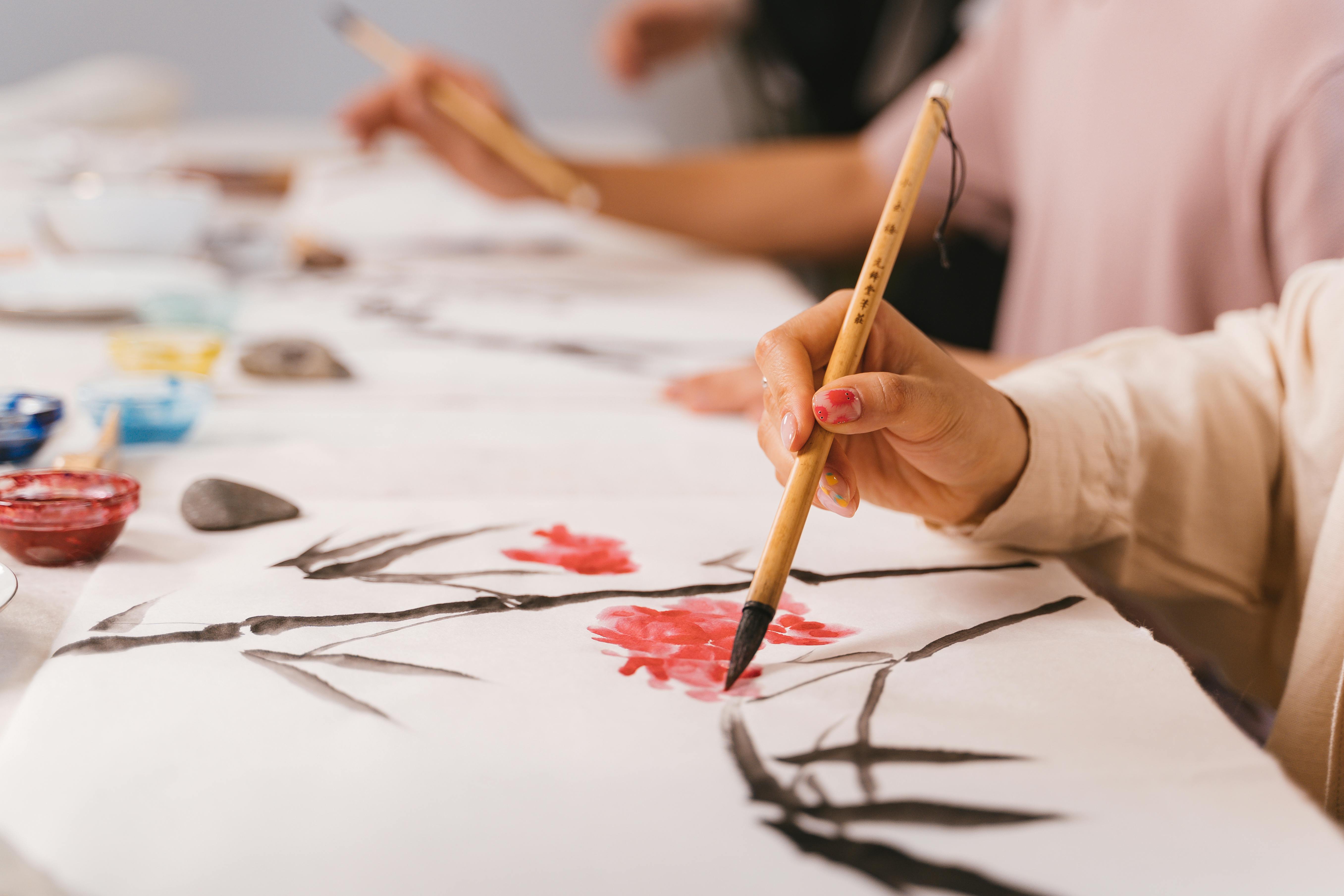 Person Holding Brown Paint Brush · Free Stock Photo