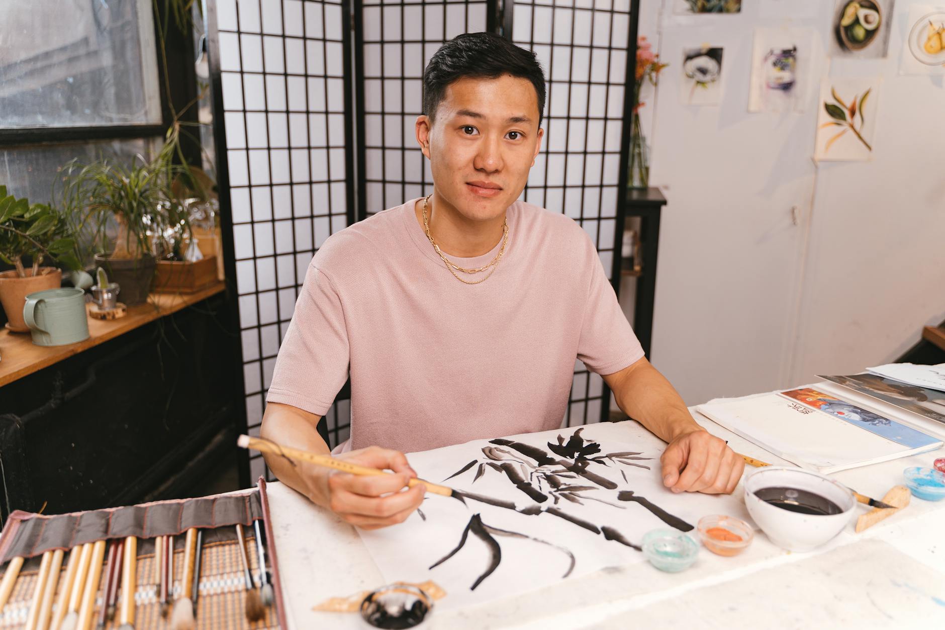 https://www.pexels.com/photo/man-painting-in-workshop-with-traditional-asian-technique-8844029/