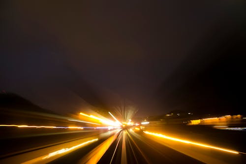 Blurred Car Lights on Street at Night