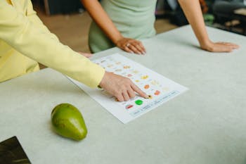 Person in Green Shirt Holding White Printer Paper