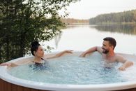 Couple Looking at Each Other while Relaxing in a Jacuzzi