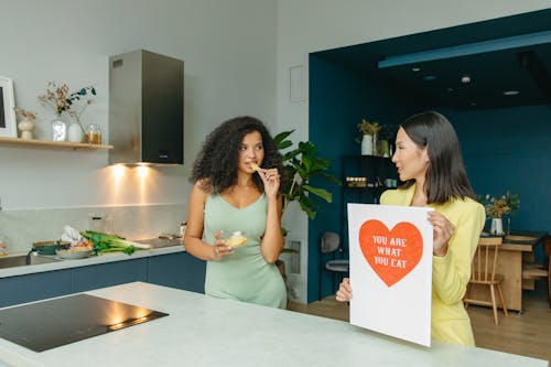 Women Promoting Healthy Eating in Kitchen