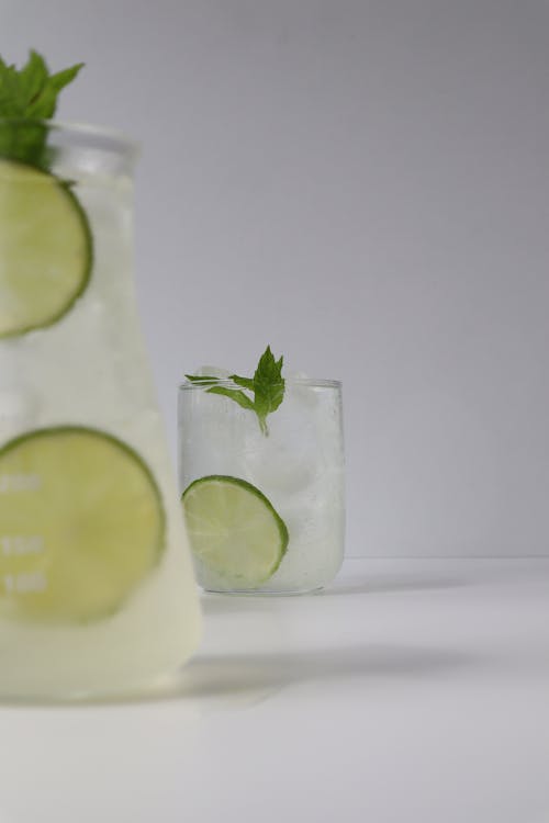 Free A Pitcher and Glass of Lemon Water  Stock Photo