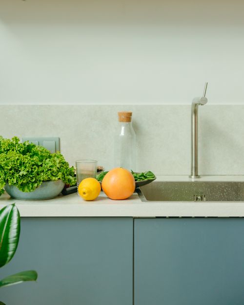 Free Organic vegetables and fruits on a kitchen counter promoting healthy living. Stock Photo