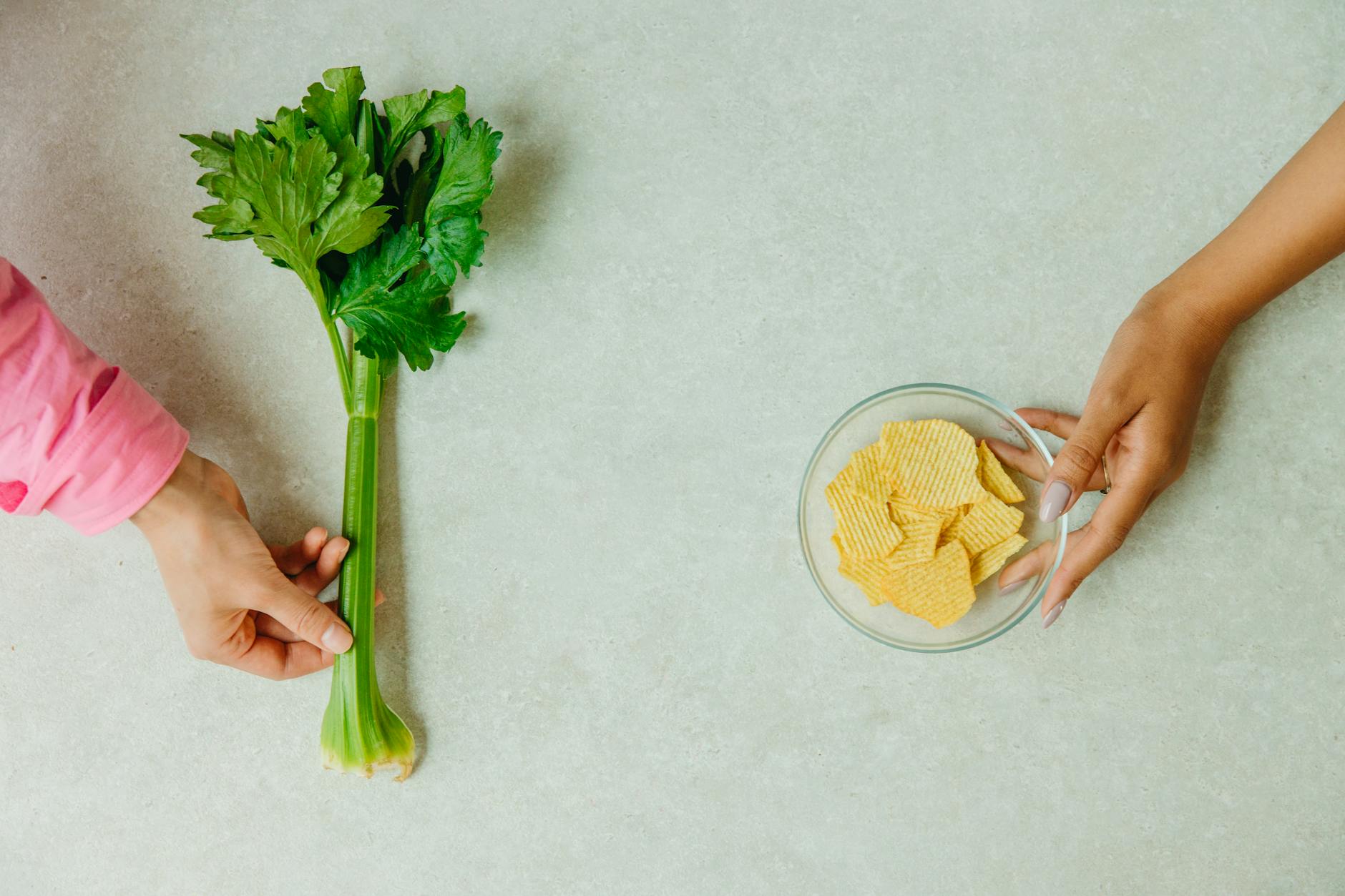 https://www.pexels.com/photo/a-person-holding-green-vegetables-on-white-surface-8845107/