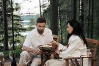 Man in White Dress Shirt Sitting Beside Woman in White Dress Shirt