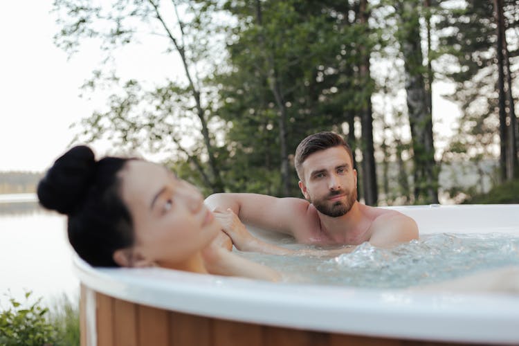 A Couple In An Outdoor Jacuzzi