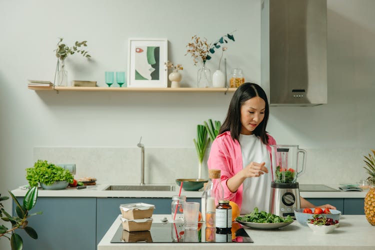 Woman Using A Blender