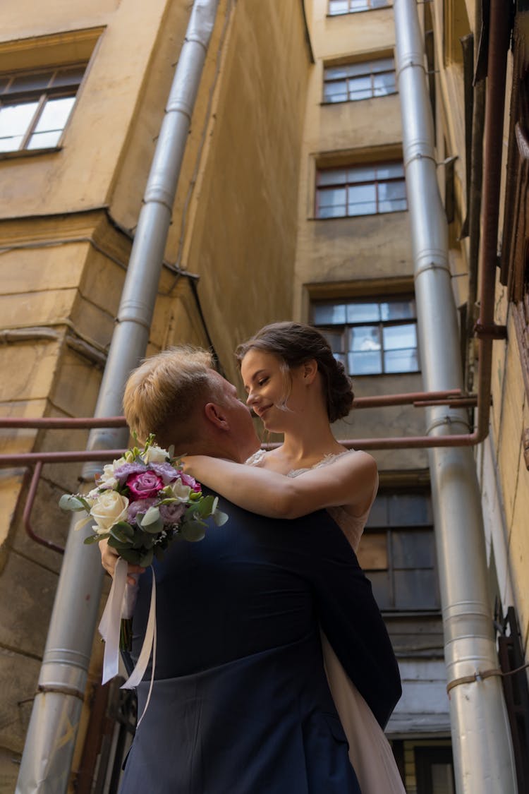 A Groom Carrying The Bride