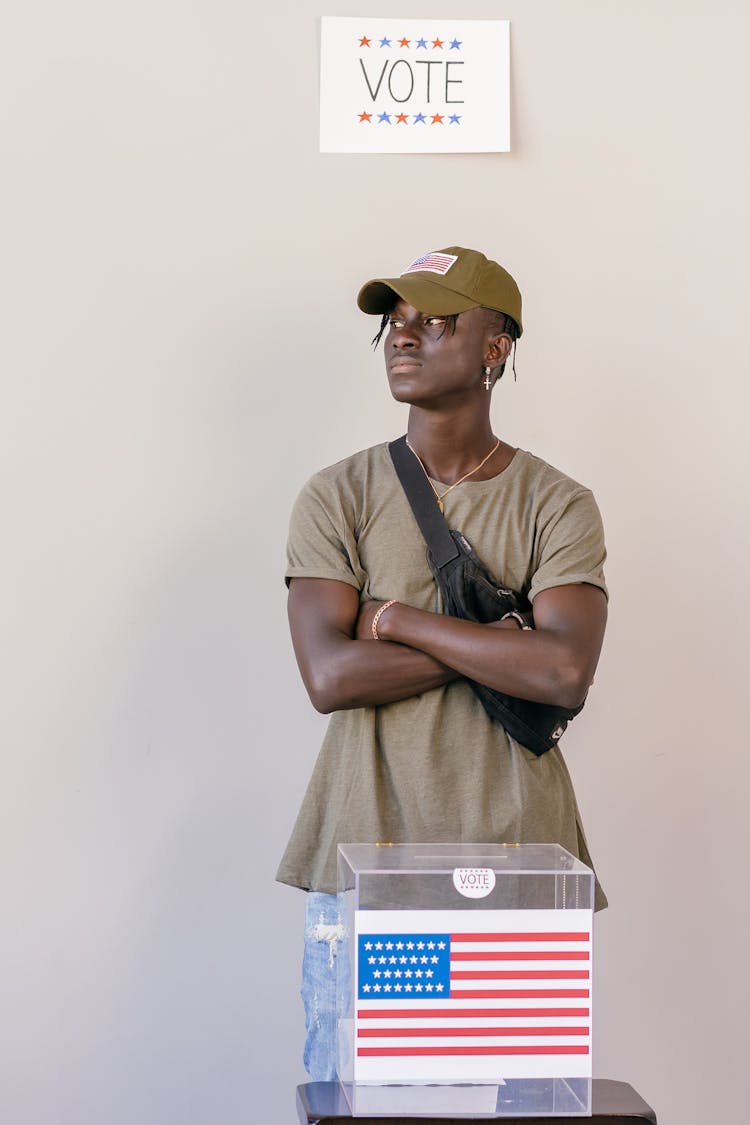 Man Standing Behind Ballot Box