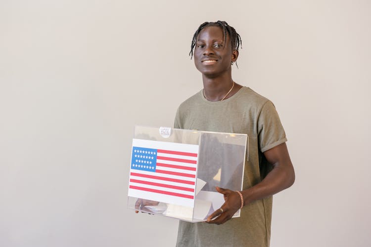 Man Carrying Ballot Box