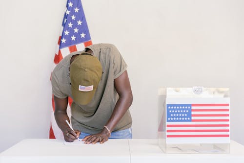 Free Man Writing Down his Vote Stock Photo