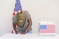 Man Writing Down his Vote