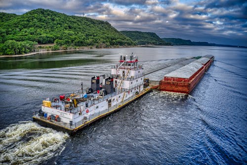 A Tow Boat Pushing Barges in the River