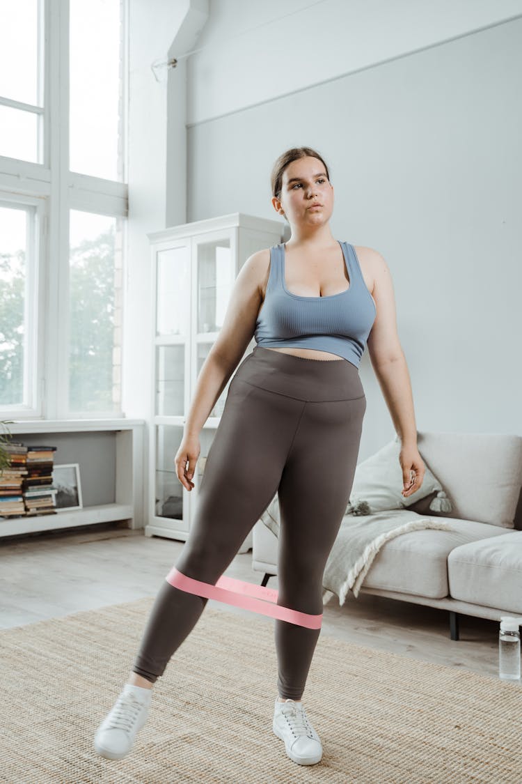 Woman Exercising Using Resistance Band