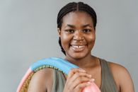 Smiling Woman in Gray Tank Top