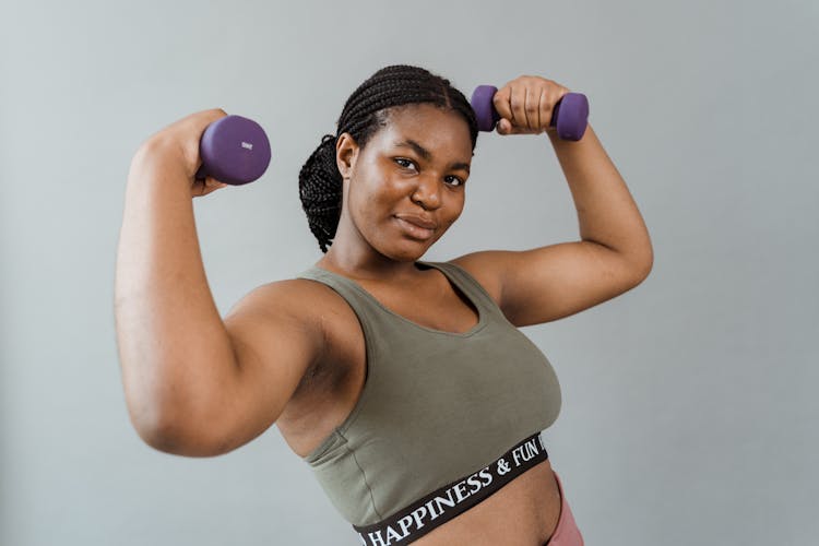 A Woman Holding Dumbbells 