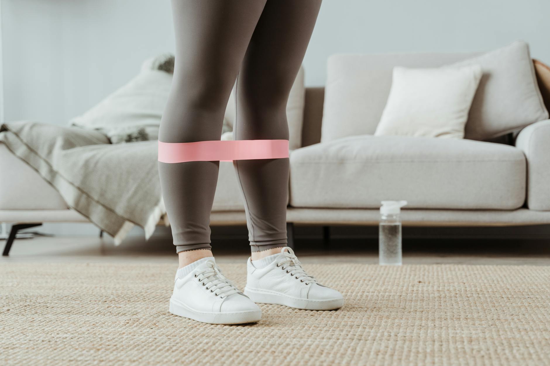 Woman using resistance band indoors