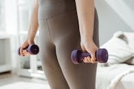 Woman in Gray Tank Top and White Panty Holding Purple Dumbbell