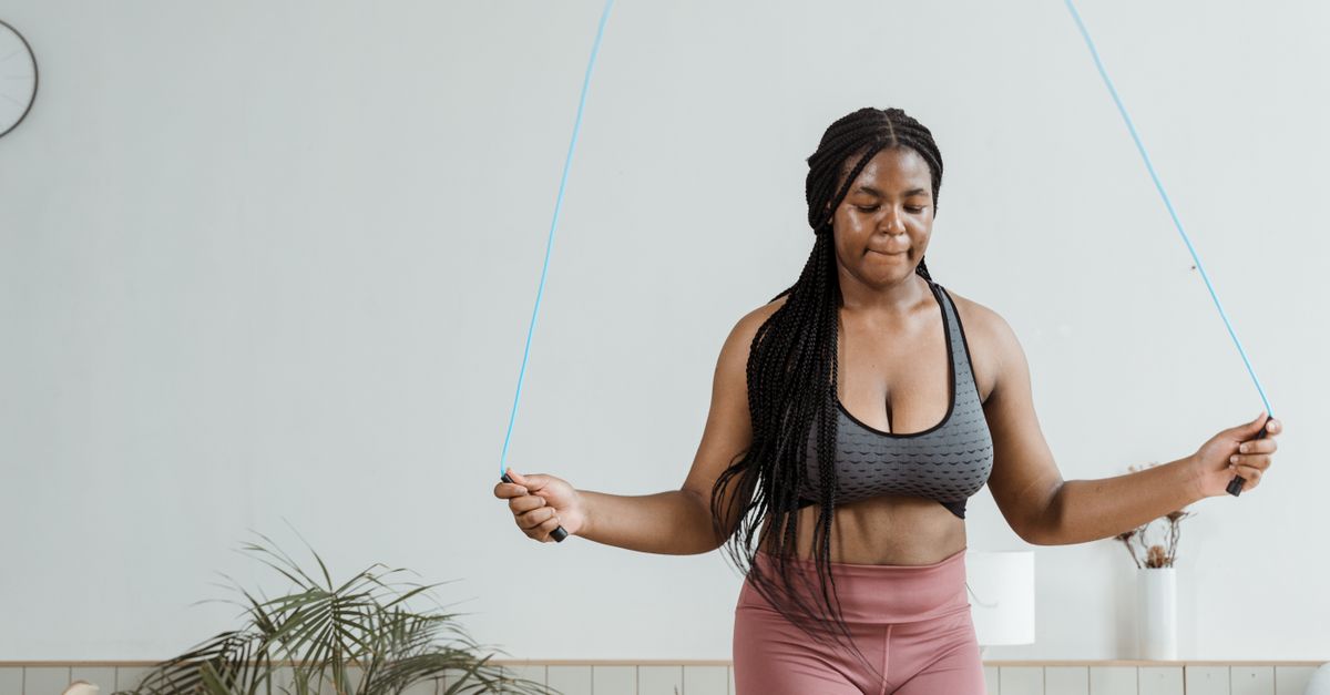 Woman looking at clock while fasting, intermittent fasting women over 40