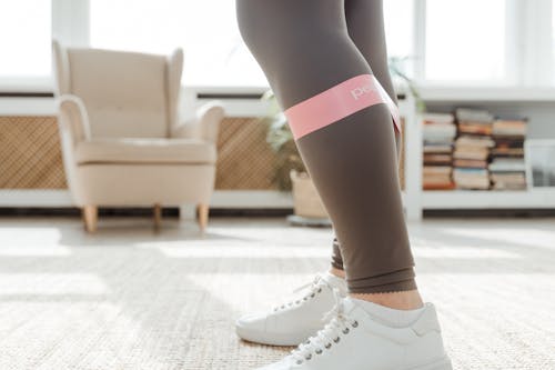 Free Person Wearing Gray Legging using Resistance Band Stock Photo