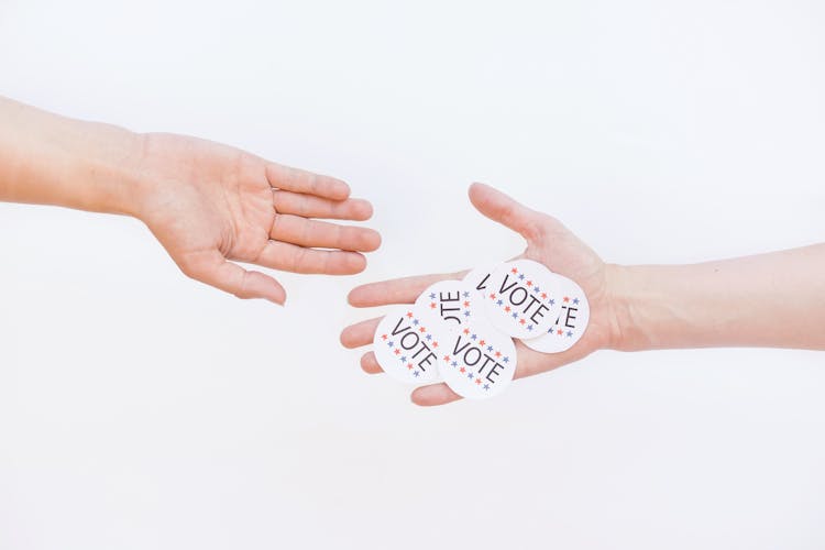 Vote Stickers On Person's Hand