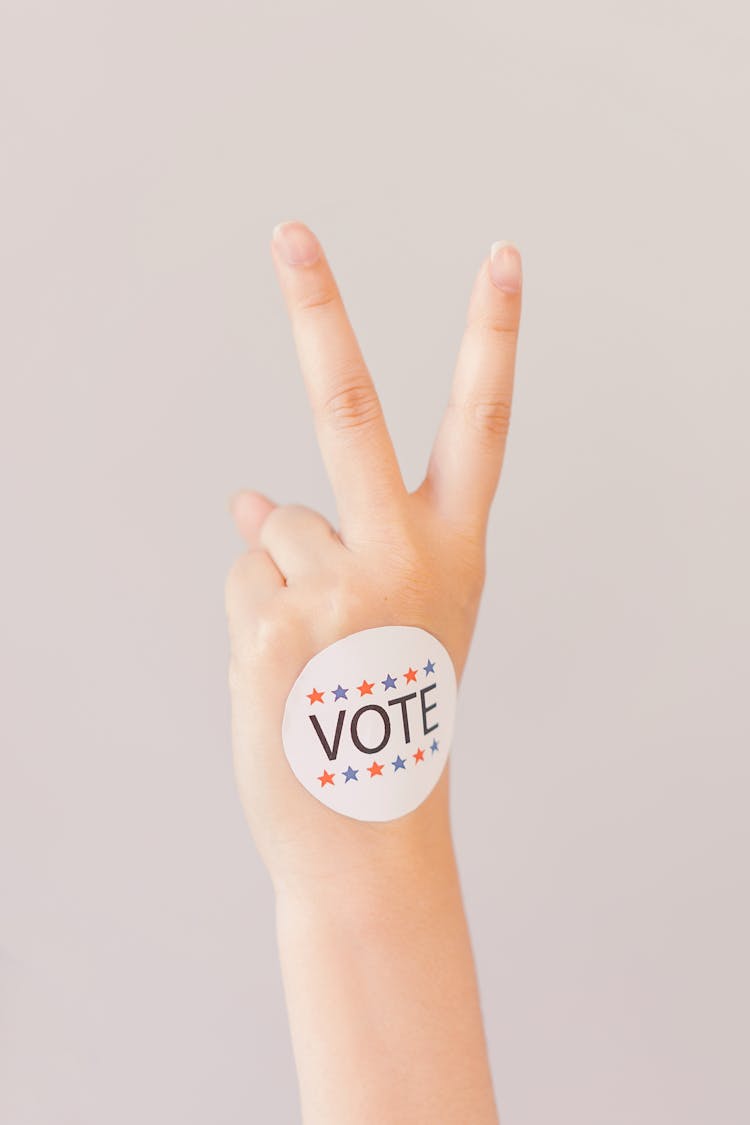 Vote Sticker On Person's Hand