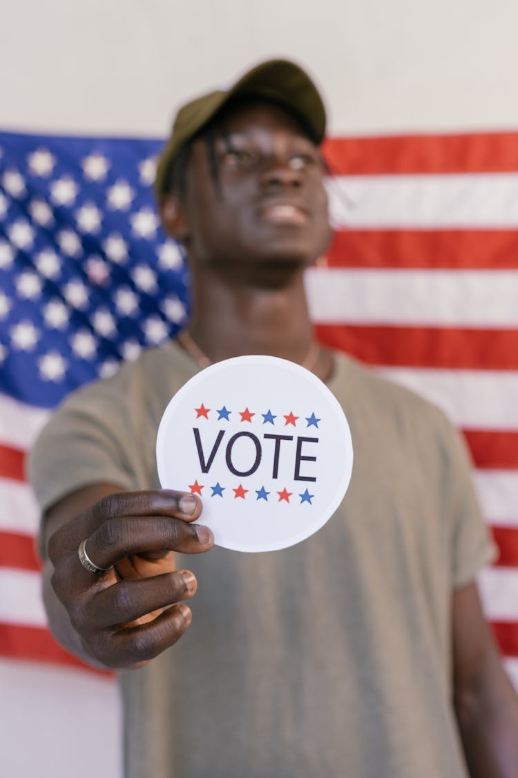 Selective Focus Photo Of Vote Badge