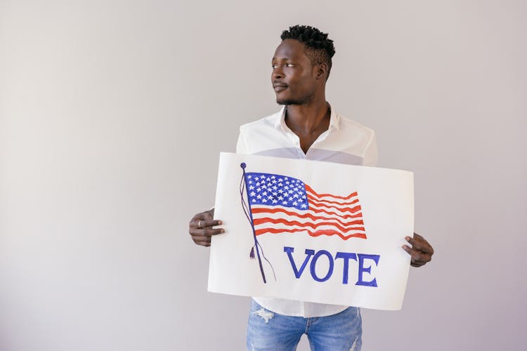 Man Holding Vote Banner