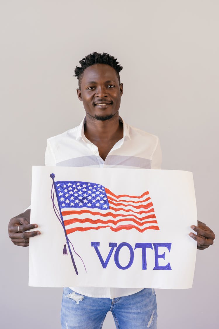 Man Holding An Election Banner