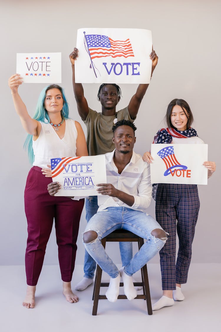 Group Of People Holding Election Banners